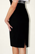 Black wool dress, with white satin collar - Close-up of bottom half