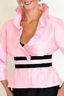 Jacket - Frilled neckline, semi fitted jacket in pink dupion silk. Skirt - fully fitted, in black - dupion silk with fabric frill and black net - detail view