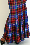 Skirt - Wool tartan, fish tail hem. Top - Nappa leather, with natural skin hemline - detail view